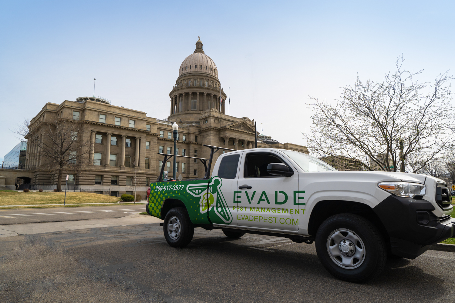 Evade Pest Management Truck in front of Boise Capital Building
